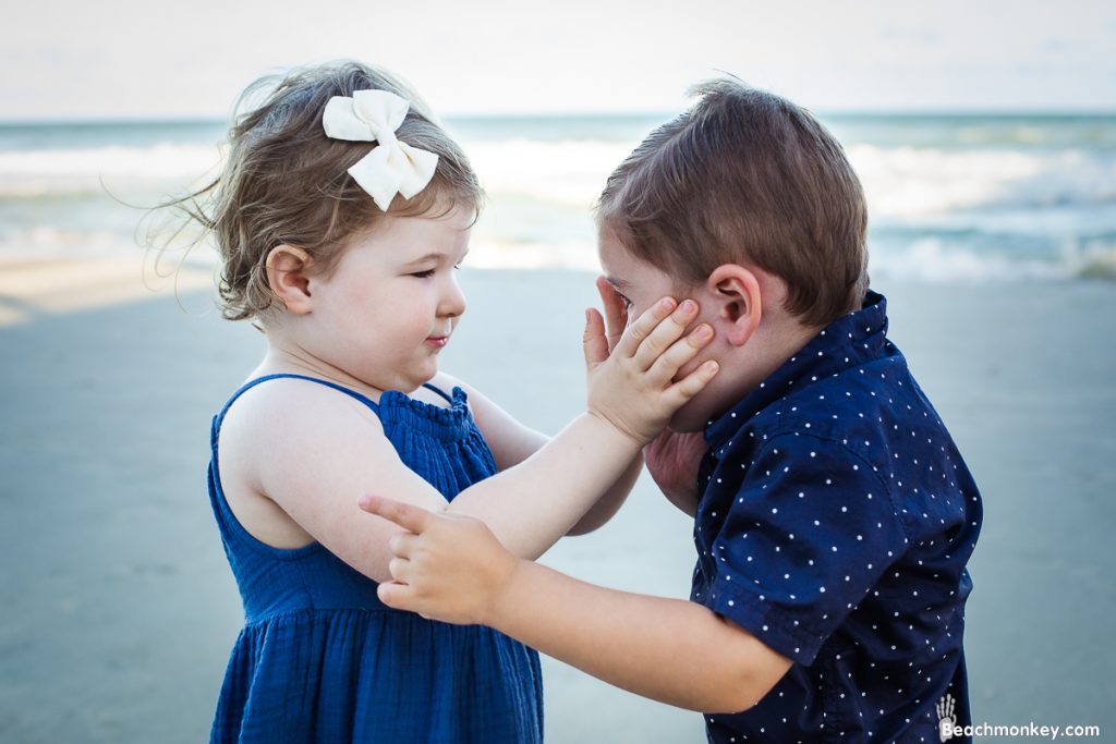 tender touch between babies A family Beach photo shoot in North Myrtle Beach, SC with Erin's family ﻿﻿Separator ﻿﻿ by Slava of beachmonkey photography, a family photographer on August 8th 2022