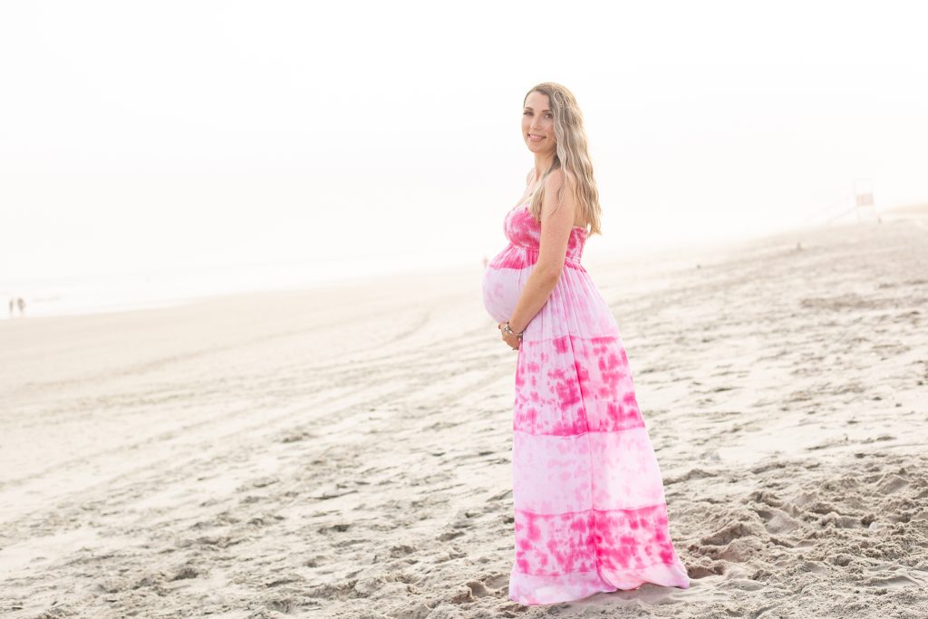 beautiful pregnant woman A family Beach photo shoot in North Myrtle Beach, SC with Sarah's family ﻿Separator ﻿ by Slava of beachmonkey photography, a family photographer on April 6th 2022