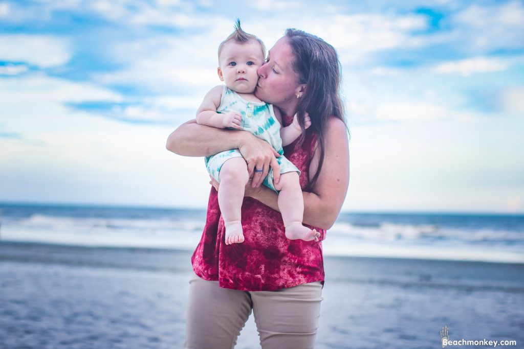 grandma and baby A family Beach photo shoot in North Myrtle Beach, SC with Alisha's family by Beachmonkey of beachmonkey photography, a family photographer on July 19th 2022